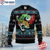 Grinch Holding Stocking Jacksonville Jaguars Ugly Xmas Sweater